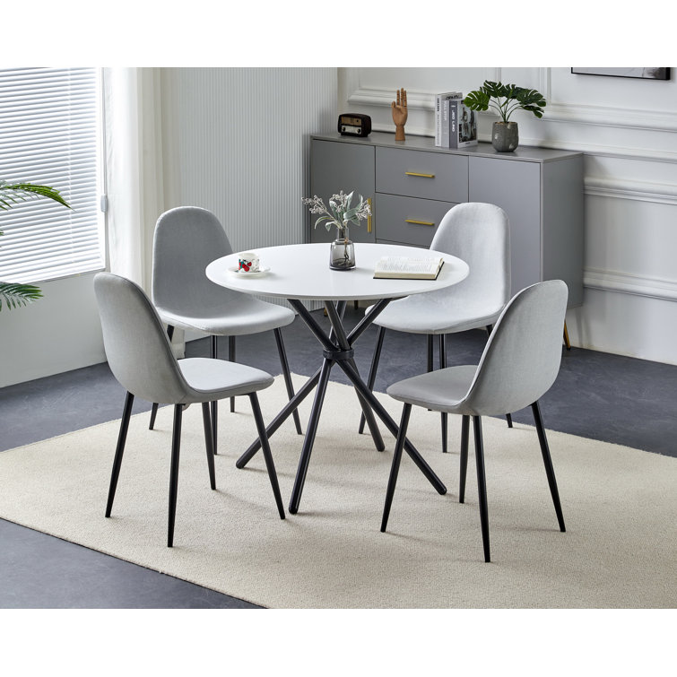 Round dining table with store four chairs